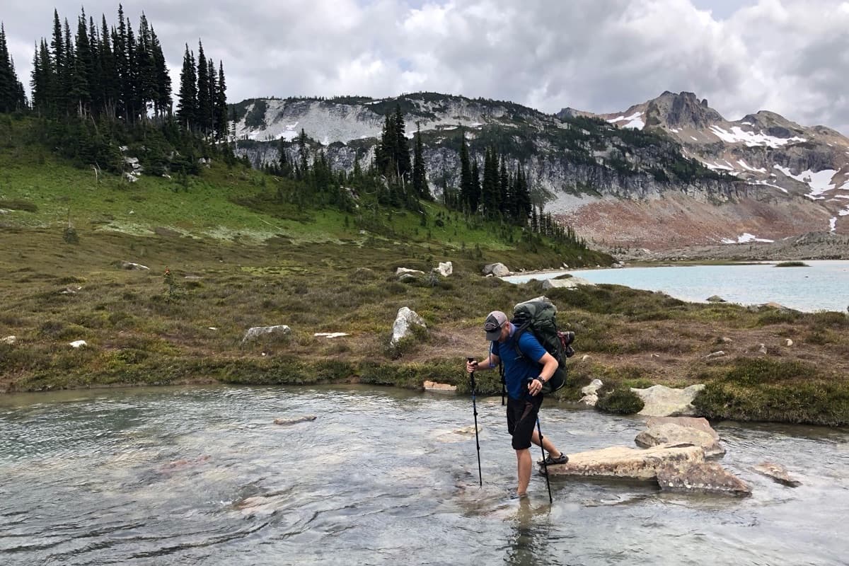 PHOTO: real backcountry scene — a hiker/backpacker, with the map