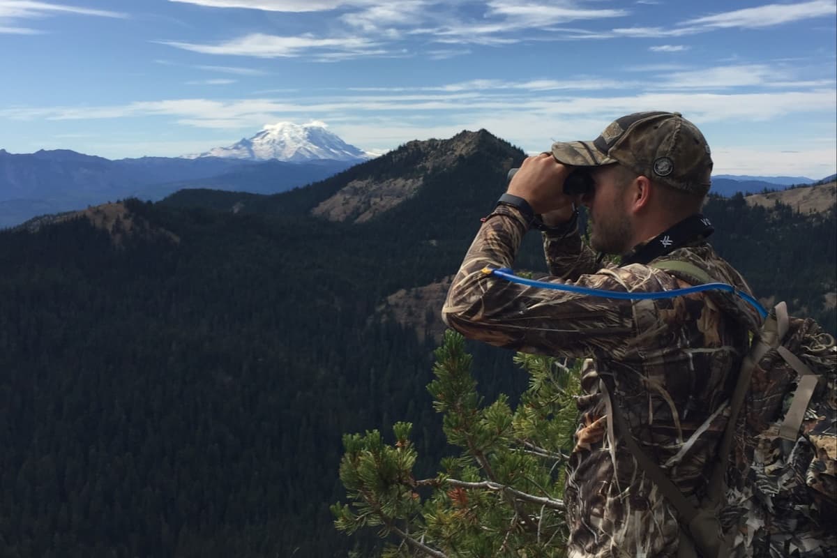 PHOTO: hunting scene — glassing / scouting, with the map + unit overlay