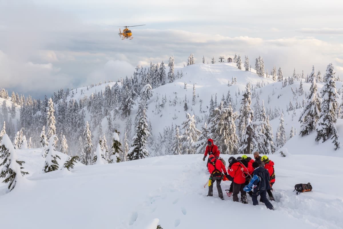 PHOTO: a real field-team scene — SAR staging, a fire crew with a division map, a forester marking a stand