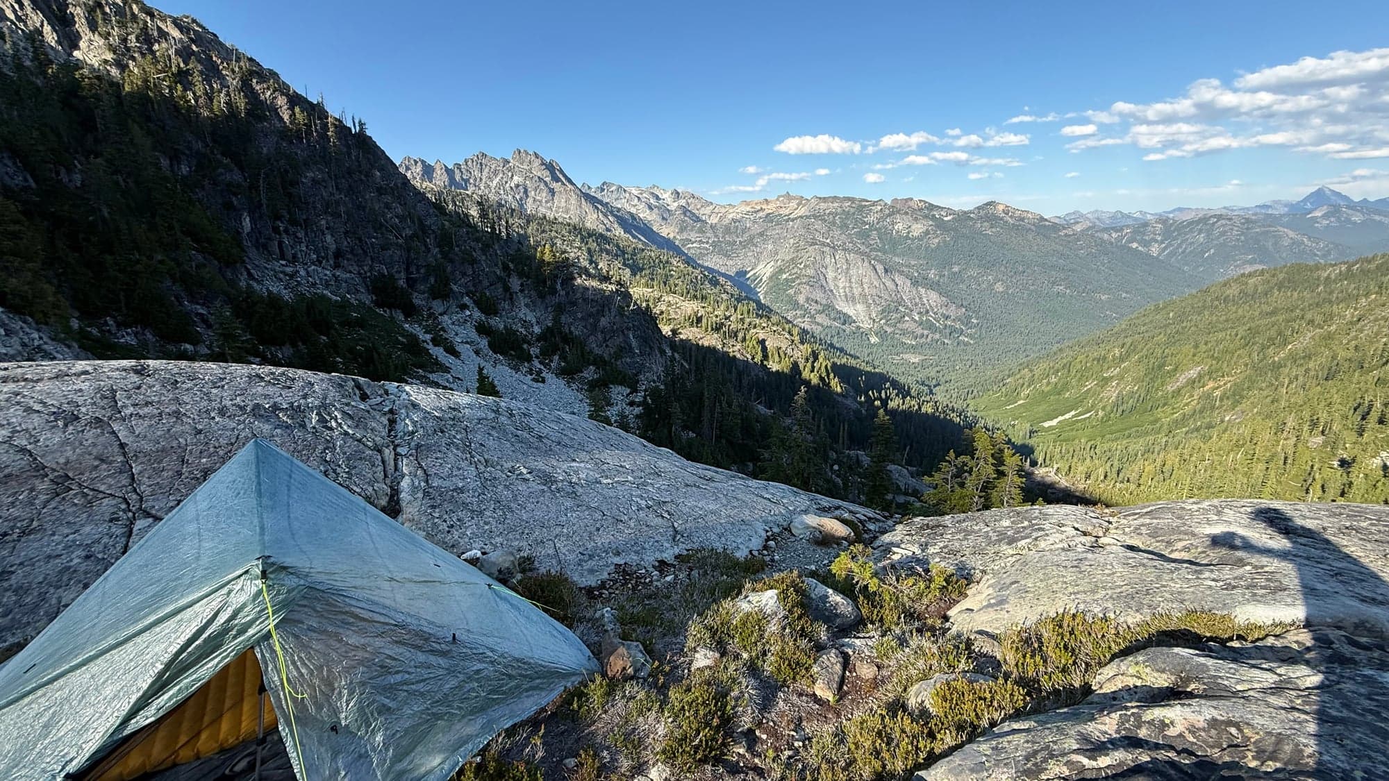 The Zpacks Duplex pitched on a granite ledge in the Alpine Lakes Wilderness, looking out at Bears Breast Mountain, Mount Daniel, and The Citadel