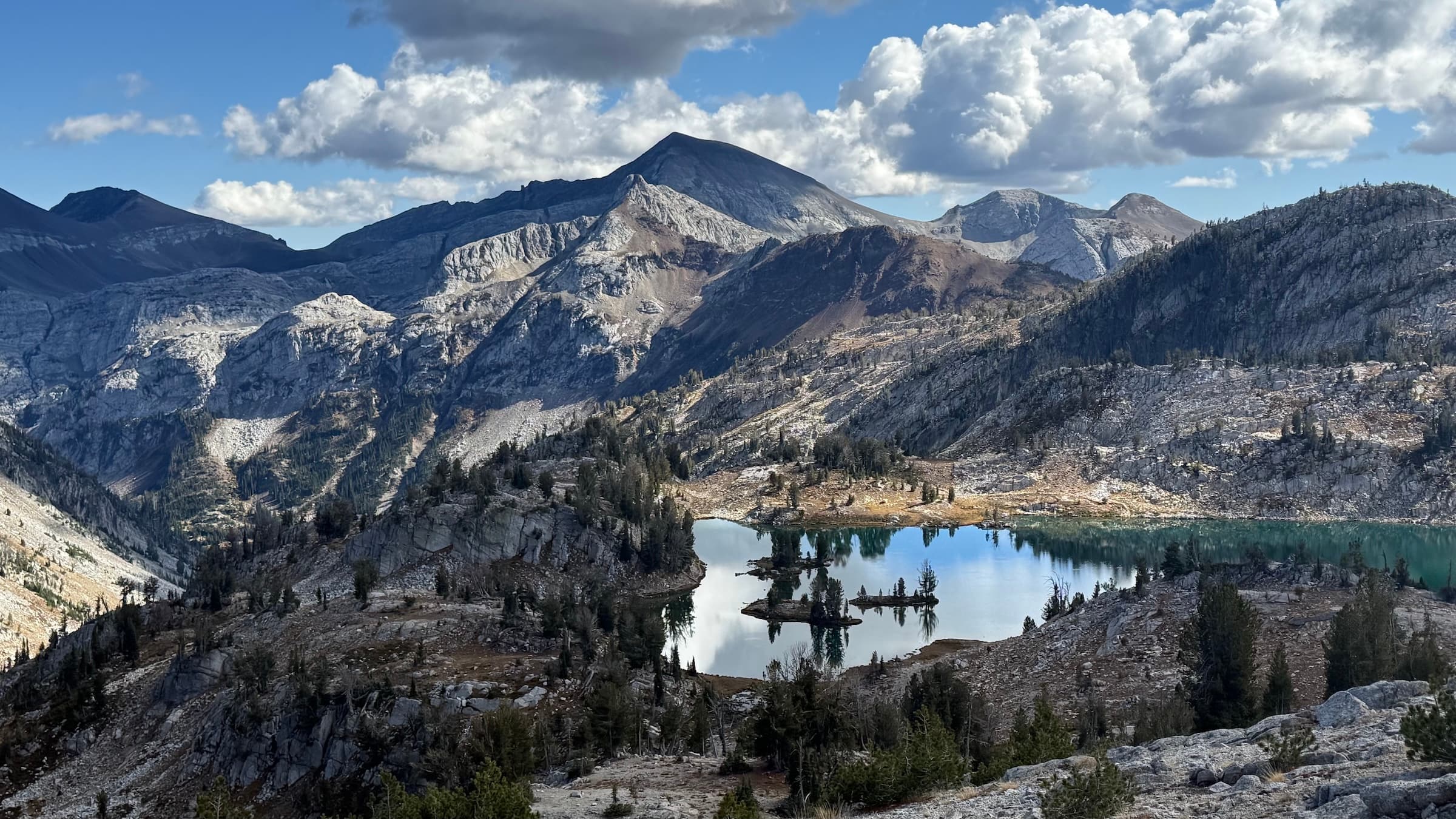 Glacier Lake seen from just below Glacier Pass in the Eagle Cap Wilderness, with granite peaks and scattered clouds