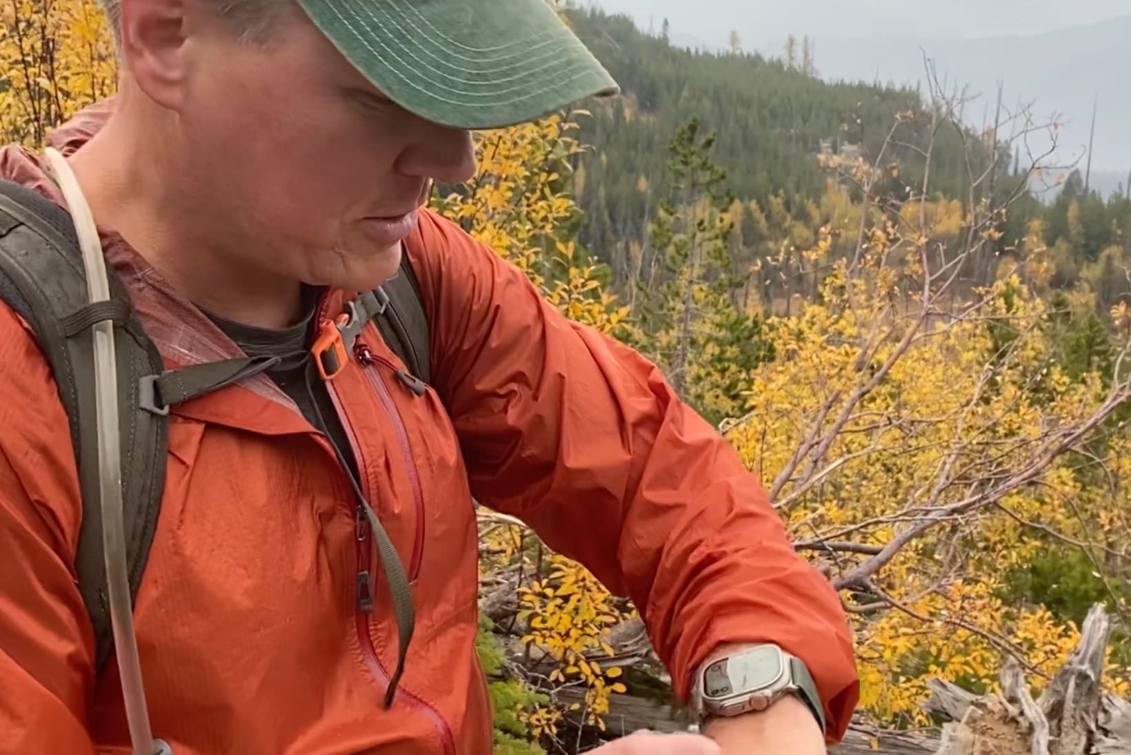 PHOTO: Apple Watch Ultra on a wrist, Action button assigned to Topo Maps+, screen showing the map