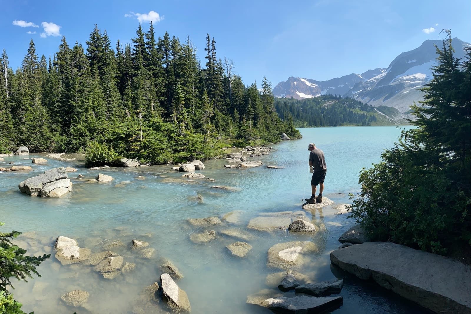 Filtering water at the outlet of Lyman Lake in the Glacier Peak Wilderness