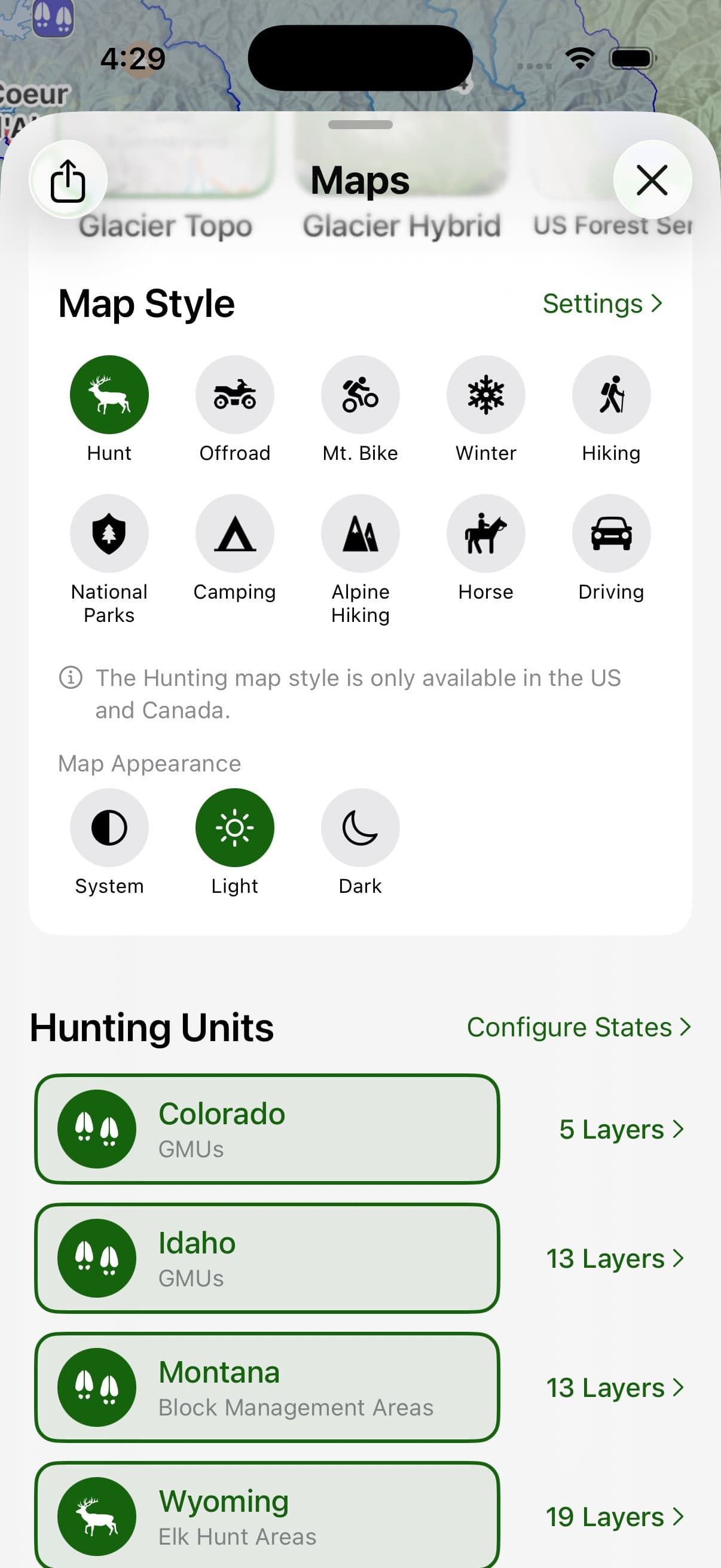 The Topo Maps+ Hunting Units list on iPhone — Colorado, Idaho, Montana, and Wyoming with the number of unit layers each one carries