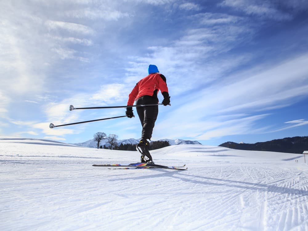 PHOTO: a nordic / skate skier breaking trail (~4:3)
