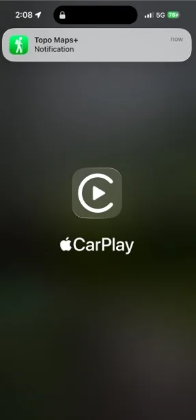 A Topo Maps+ notification on the Lock Screen after connecting to CarPlay