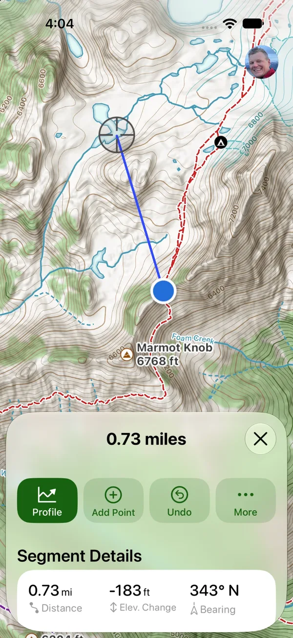 A measurement line from your location to the crosshairs, with the distance, elevation change, and bearing in the sheet