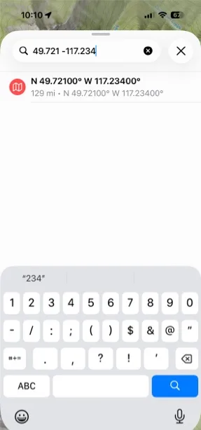 A coordinate typed into search with the matching result below